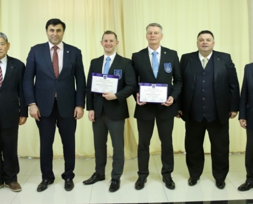 British Judo referees Archi Shrimpton and James McBeath receiving their IJF A grade