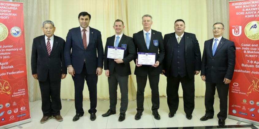 British Judo referees Archi Shrimpton and James McBeath receiving their IJF A grade