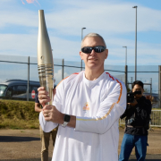 Former Paralympic Gold medallist Ian Rose with the 2024 Paralympic Games Torch